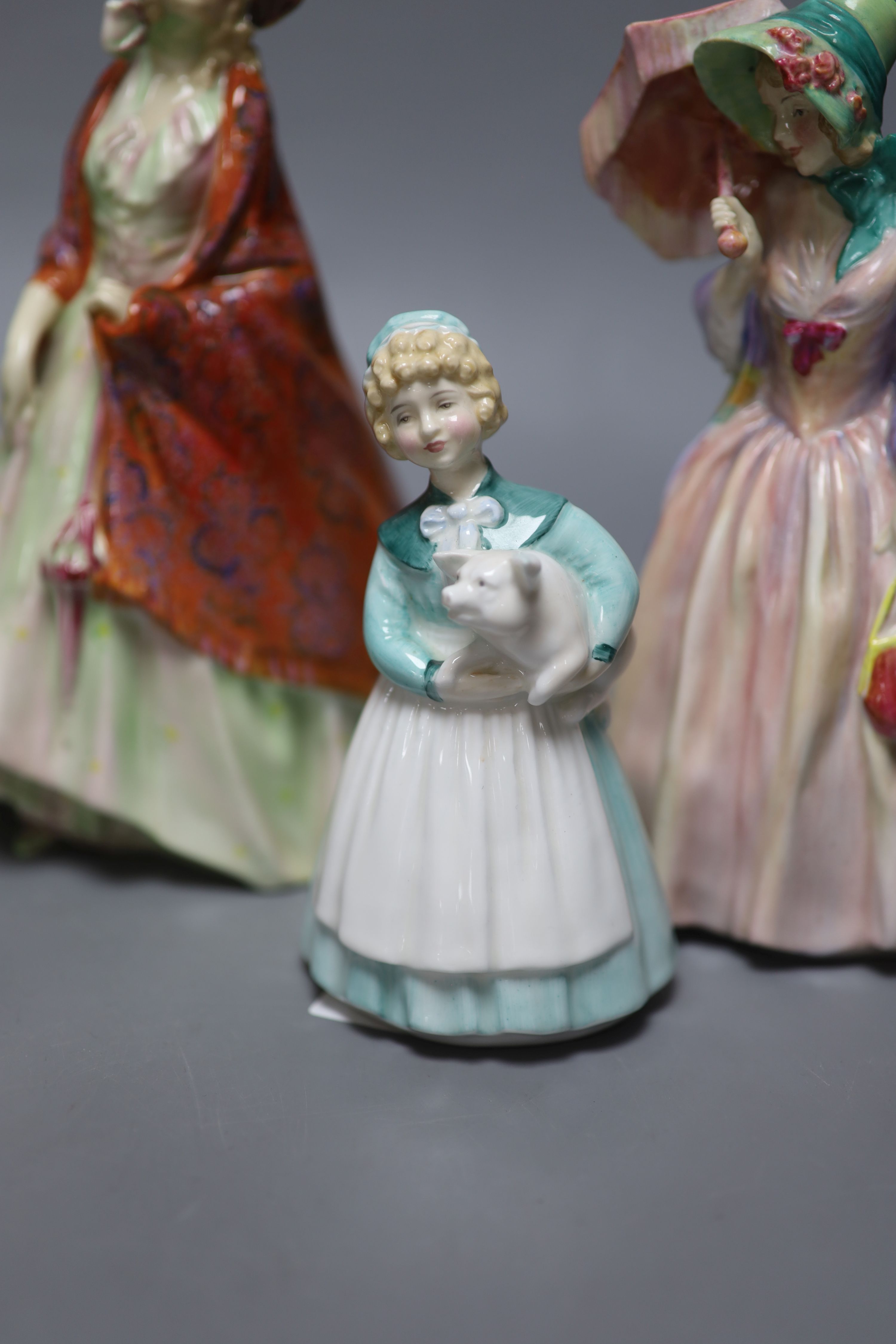 A collection of six Royal Doulton figures; The Paisley Shawl HN1392, Top o the hill HN1834, Clarissa HN2345, Stayed at home HN2207, Ja